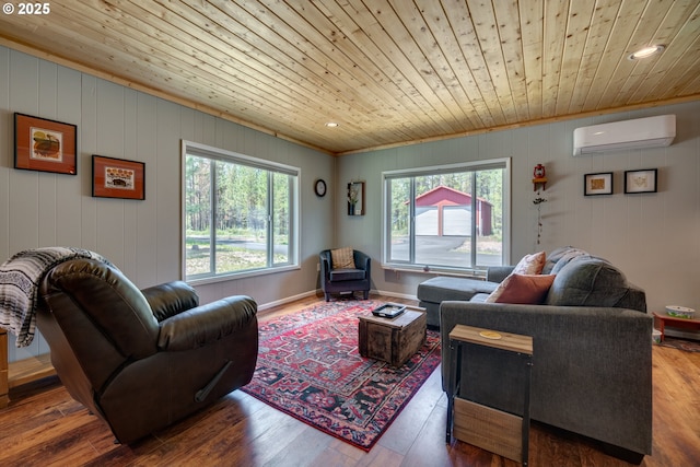 living room with wood ceiling, baseboards, an AC wall unit, and wood finished floors