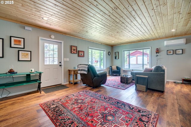 living area with wood ceiling, a wall mounted air conditioner, baseboards, and wood finished floors