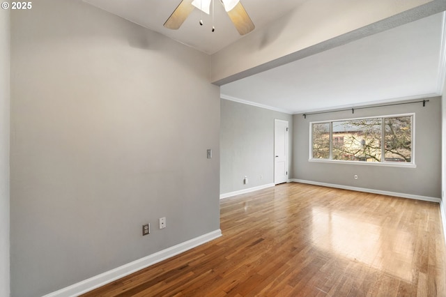 spare room with ceiling fan and wood-type flooring