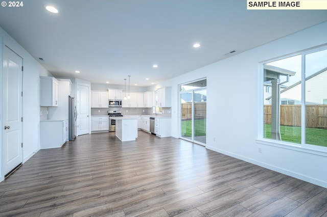 18615 NE 41st Pl Lot 288, Vancouver, WA 98686 - unfurnished living room featuring visible vents, recessed lighting, dark wood-type flooring, and baseboards