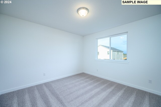 18615 NE 41st Pl Lot 288, Vancouver, WA 98686 - spare room featuring carpet and baseboards