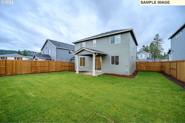 18615 NE 41st Pl Lot 288, Vancouver, WA 98686 - back of house with a lawn, a fenced backyard, and a patio area