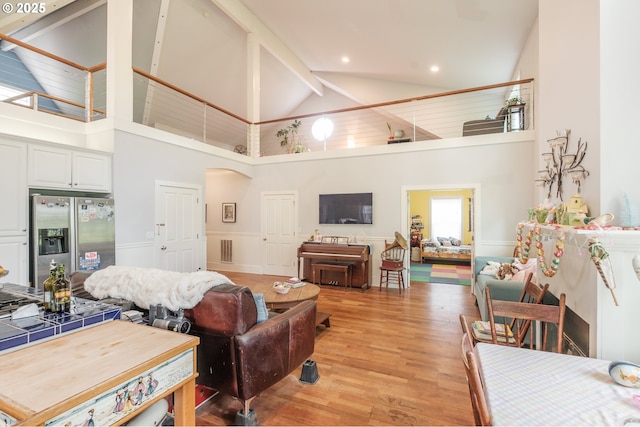 895 Pine Forest Dr, Eugene, OR 97405 - living room featuring high vaulted ceiling, light wood-type flooring, beam ceiling, recessed lighting, and arched walkways