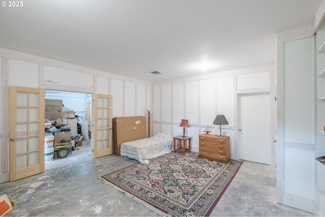 895 Pine Forest Dr, Eugene, OR 97405 - living area featuring french doors, concrete floors, and a decorative wall