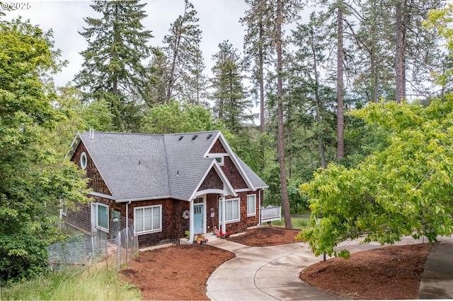 895 Pine Forest Dr, Eugene, OR 97405 - view of front facade featuring roof with shingles and view of scattered trees