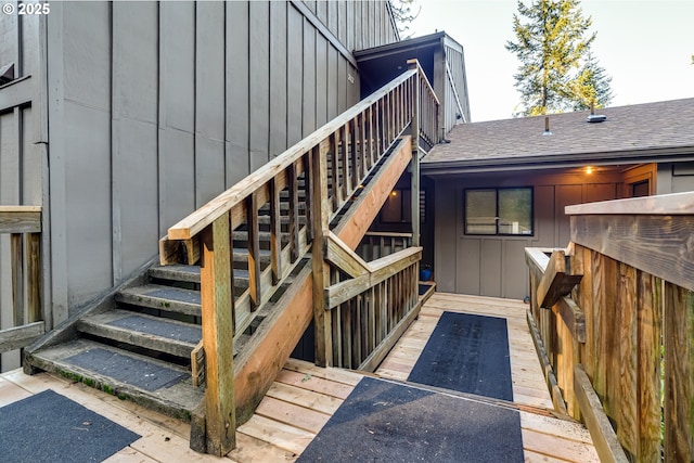 218 Trailside Loop Unit 218, Eugene, OR 97405 - view of exterior entry featuring board and batten siding, a deck, and a shingled roof