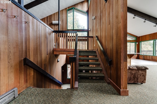218 Trailside Loop Unit 218, Eugene, OR 97405 - staircase with a baseboard heating unit, carpet, rail lighting, wooden walls, and lofted ceiling