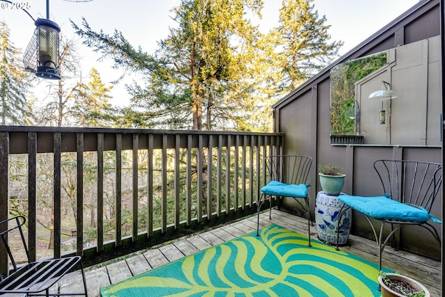 wooden balcony featuring a deck