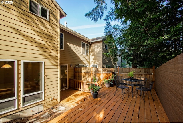deck with fence and outdoor dining space
