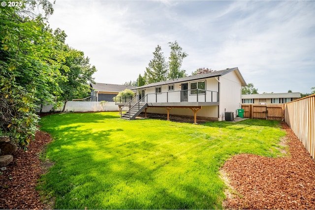 3250 SW Binford Lake Pkwy, Gresham, OR 97080 - rear view of house featuring a fenced backyard, stairs, and a wooden deck