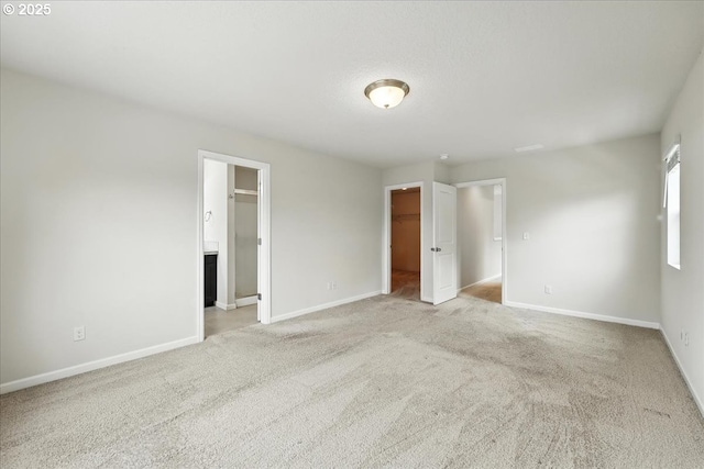 2103 SE 18th Aly, Gresham, OR 97080 - unfurnished bedroom featuring a walk in closet, light colored carpet, a closet, and ensuite bathroom