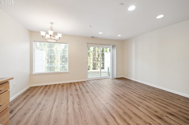 7612 NE 34th Ave Unit A8, Vancouver, WA 98665 - kitchen with a chandelier, light wood-style floors, recessed lighting, and white appliances