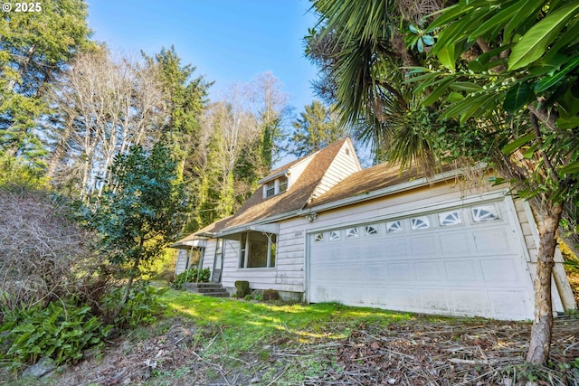 view of property exterior with a garage