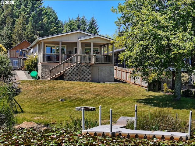 90637 Lewis Rd, Warrenton, OR 97146 - view of front facade featuring a front lawn, covered porch, and stairs