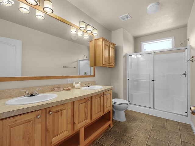 90637 Lewis Rd, Warrenton, OR 97146 - bathroom featuring a stall shower and double vanity