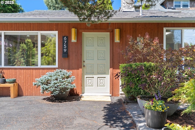 6759 SW 52nd Ave, Portland, OR 97219 - entrance to property featuring roof with shingles and a chimney