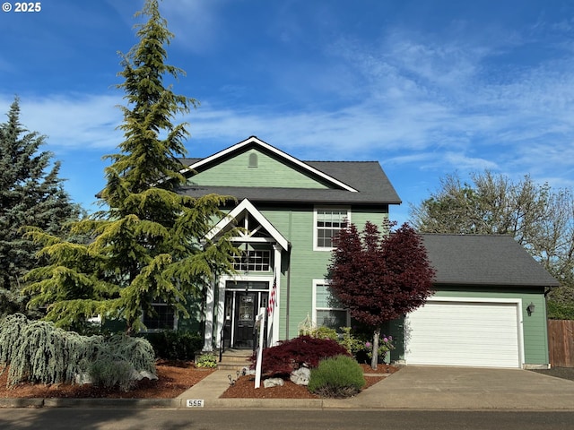 view of front of house with concrete driveway and a garage