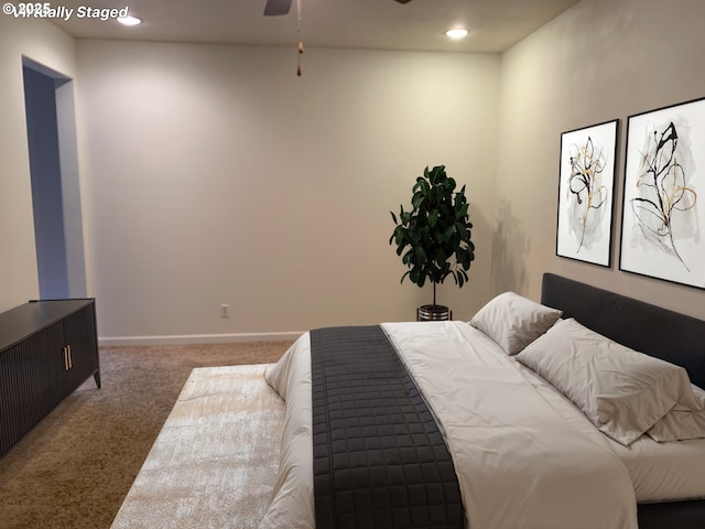 bedroom featuring ceiling fan and dark colored carpet