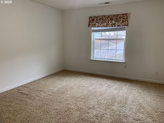 unfurnished room featuring carpet