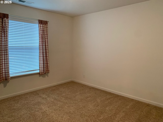 view of carpeted spare room