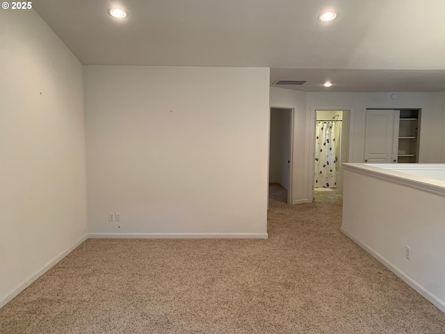 spare room with light colored carpet