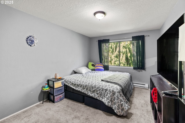 carpeted bedroom featuring a textured ceiling and baseboard heating