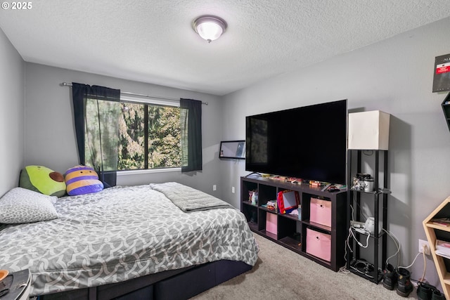 carpeted bedroom featuring a textured ceiling