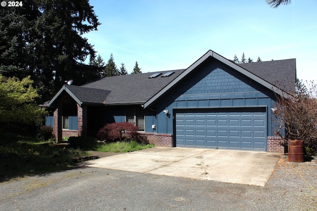 ranch-style home featuring brick siding, an attached garage, concrete driveway, and roof with shingles