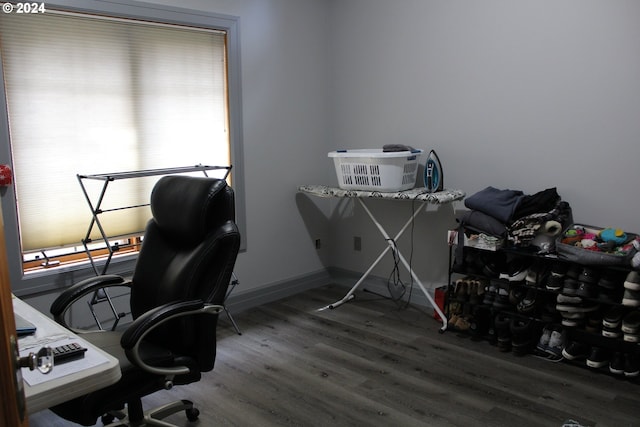 office area featuring baseboards and wood finished floors