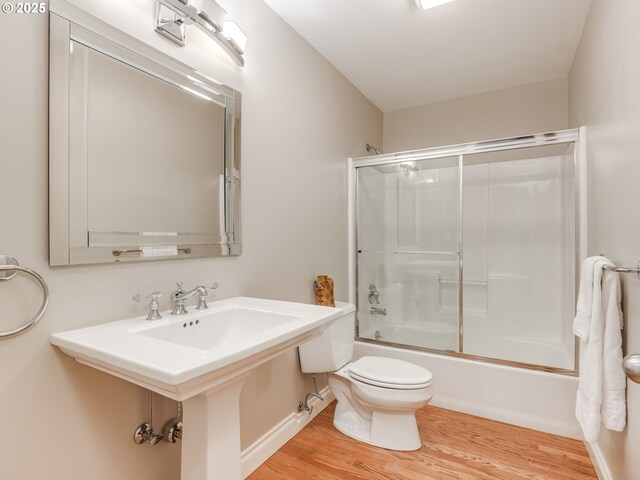 6903 SE Riverside Dr Unit 20, Vancouver, WA 98664 - full bath featuring toilet, wood finished floors, and combined bath / shower with glass door