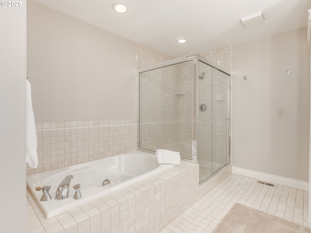 6903 SE Riverside Dr Unit 20, Vancouver, WA 98664 - bathroom featuring a tub with jets, tile patterned flooring, a stall shower, and recessed lighting