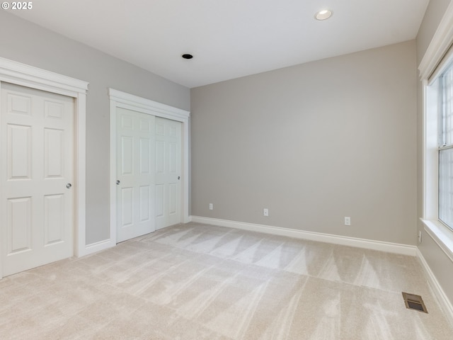 6903 SE Riverside Dr Unit 20, Vancouver, WA 98664 - unfurnished bedroom with light colored carpet, multiple windows, baseboards, and recessed lighting
