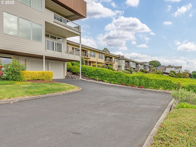 6903 SE Riverside Dr Unit 20, Vancouver, WA 98664 - view of asphalt road with a residential view and curbs