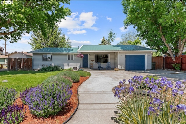 1220 Baker St, Baker City, OR 97814 - ranch-style home with an attached garage, concrete driveway, and metal roof