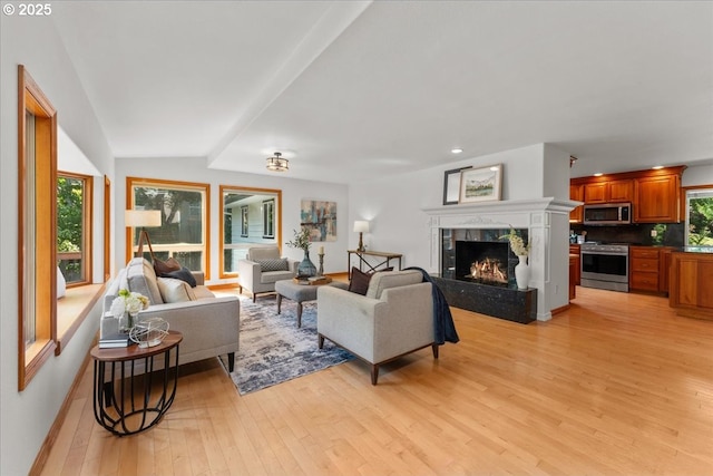 9150 SW Salmon St, Portland, OR 97225 - living room with light wood-style flooring, a high end fireplace, and recessed lighting