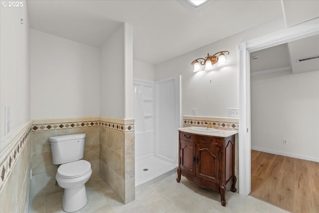 9150 SW Salmon St, Portland, OR 97225 - full bath with vanity, a wainscoted wall, a shower, and tile walls