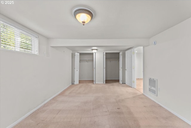 9150 SW Salmon St, Portland, OR 97225 - unfurnished bedroom with heating unit, multiple closets, and light carpet
