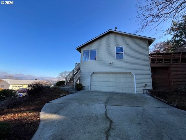 view of side of property featuring a garage