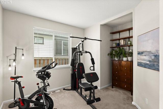 carpeted bedroom with ceiling fan, lofted ceiling, and ensuite bath