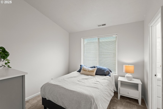 carpeted bedroom featuring vaulted ceiling