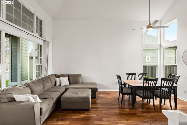 living room featuring high vaulted ceiling, dark hardwood / wood-style floors, and ceiling fan