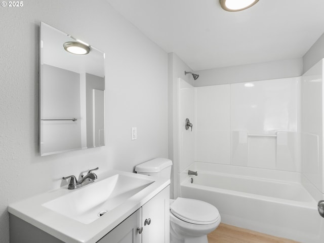 full bathroom featuring vanity, toilet, bathing tub / shower combination, and hardwood / wood-style floors