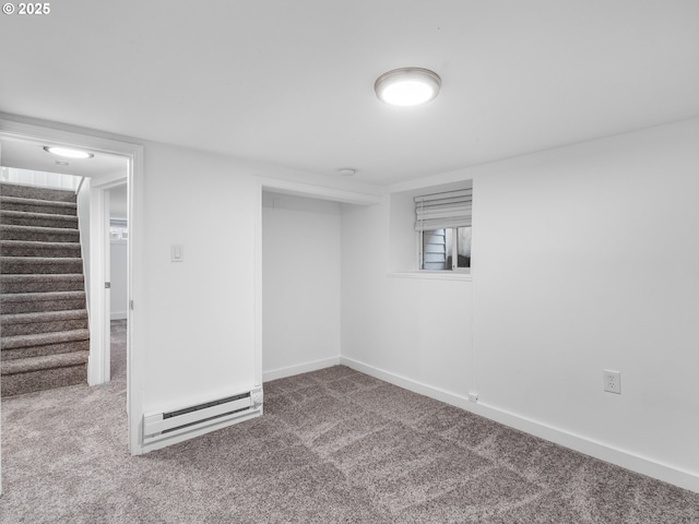 basement featuring carpet flooring and baseboard heating