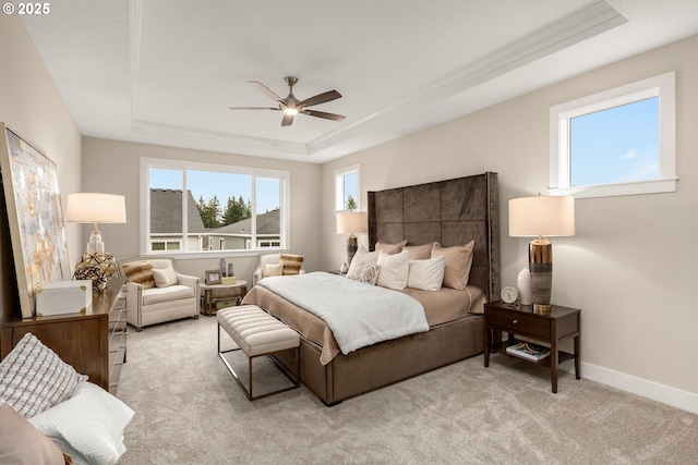 17641 NW Layla Dr, Portland, OR 97229 - bedroom featuring a tray ceiling, baseboards, light carpet, and ceiling fan