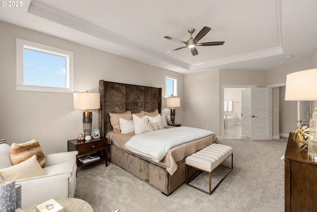 17641 NW Layla Dr, Portland, OR 97229 - bedroom featuring a raised ceiling, light carpet, ensuite bath, ornamental molding, and ceiling fan