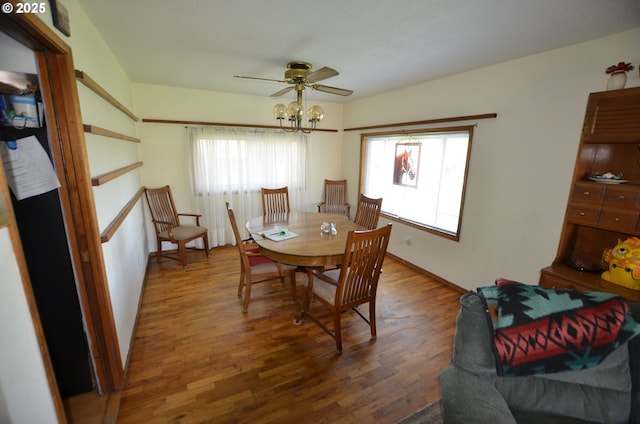 46083 Adams Rd, Pendleton, OR 97801 - dining room with wood finished floors, a ceiling fan, and a chandelier