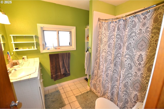 46083 Adams Rd, Pendleton, OR 97801 - full bathroom featuring vanity, tile patterned floors, toilet, curtained shower, and baseboards