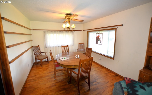 46083 Adams Rd, Pendleton, OR 97801 - dining area with healthy amount of natural light, wood finished floors, a ceiling fan, and a chandelier