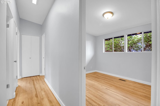 6255 SW Mad Hatter Ln, Beaverton, OR 97008 - hallway featuring wood finished floors and baseboards