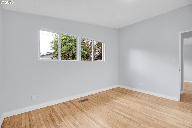 6255 SW Mad Hatter Ln, Beaverton, OR 97008 - empty room featuring baseboards and wood finished floors